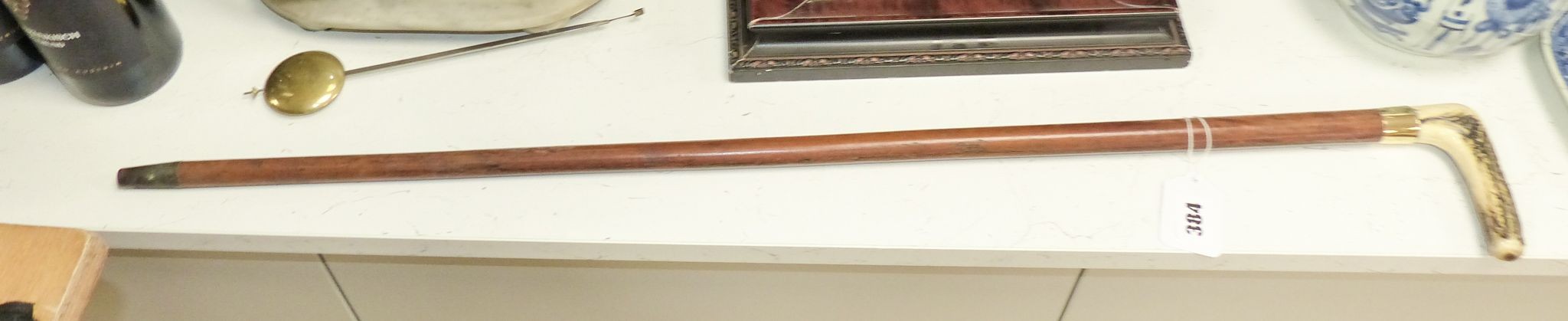 A Victorian 9ct gold mounted cane with antler handle 84cm